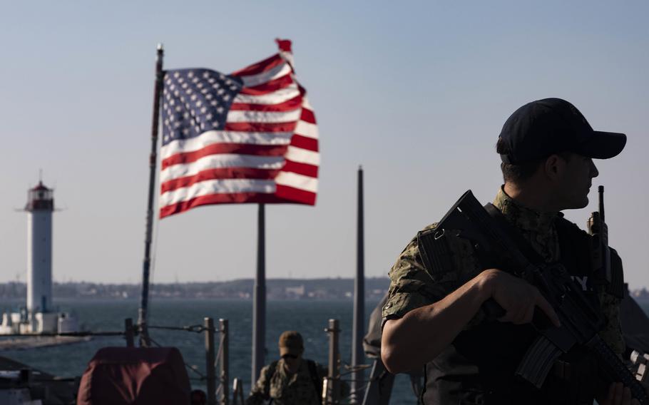 Petty Officer 2nd Class Emilio Orozco-Murcia stands watch aboard the destroyer USS Ross  in Odessa, Ukraine, for participation in Exercise Sea Breeze, June 27, 2021. 