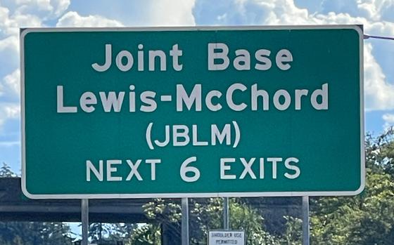 An exit sign for Joint Base Lewis-McChord on Interstate 5 near Tacoma, Wash.