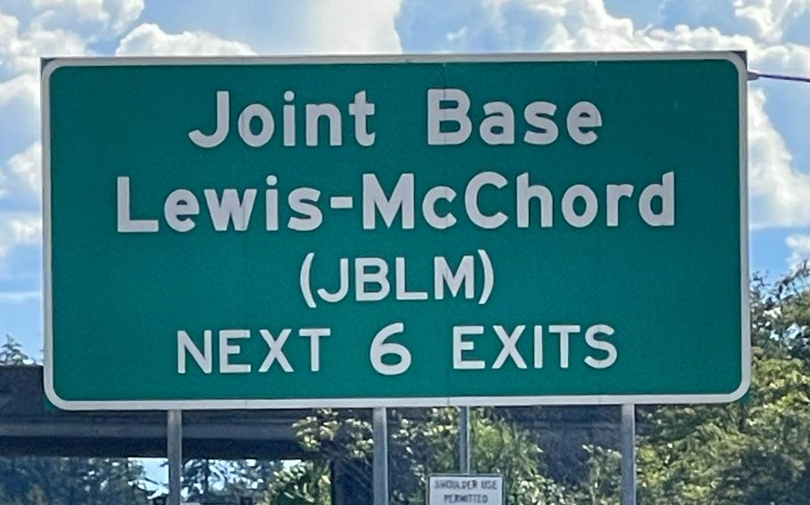Road sign that reads, “Joint Base Lewis-McChord.”