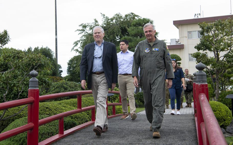 U.S. Forces Japan commander Lt. Gen. Ricky Rupp, right, walks with Secretary of the Air Force Frank Kendall at Yokota Air Base in western Tokyo, Aug. 25, 2022.