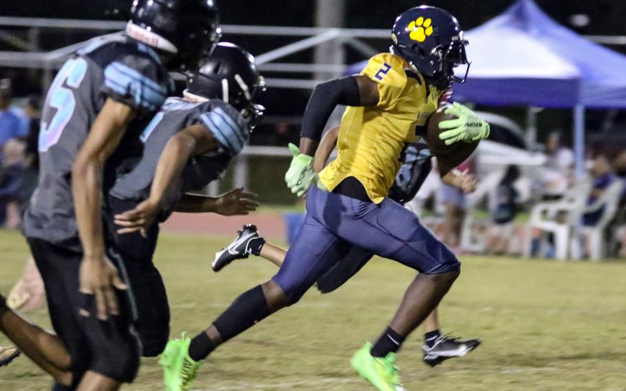 Guam High's Benjamin Harris darts away from Southern's defense.