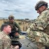 A U.S. Army major gets a tour of the Hungarian Leopard 2A7 main battle tank.