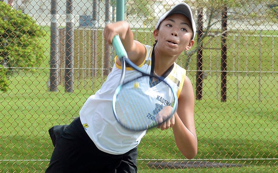 Kadena's Christine Ryan serves against Kubasaki during Thursday's Okinawa high school tennis matches. Ryan and her doubles partner Mary Tracy beat Kubasaki's Jessica Blackston and Lillian Law 8-1, one of only four matches completed; the rest of the 14 were rained out.