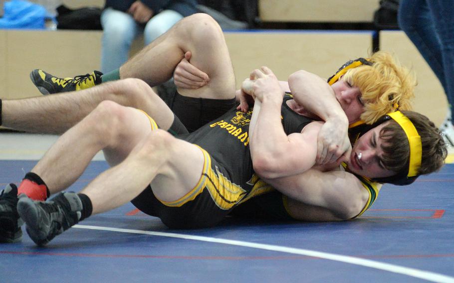 SHAPE’s Zack Call, right, beat Stuttgart’s Nic Ellinger in a 132-pound match in second-day action at the high school 2022 Wrestling Tournament in Ramstein, Germany, Feb. 11, 2022.