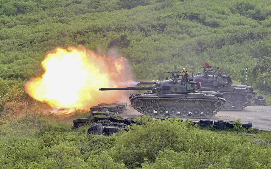 CM-11 tanks fire their cannons during a live-fire military exercise in Pingtung county, southern Taiwan, on Sept. 7, 2022. 