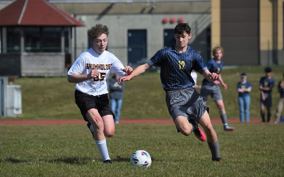 Ansbach's Lucas Rudy battles for the ball with Baumholder’s George Cobin during their match on Saturday, March 18, 2023. 