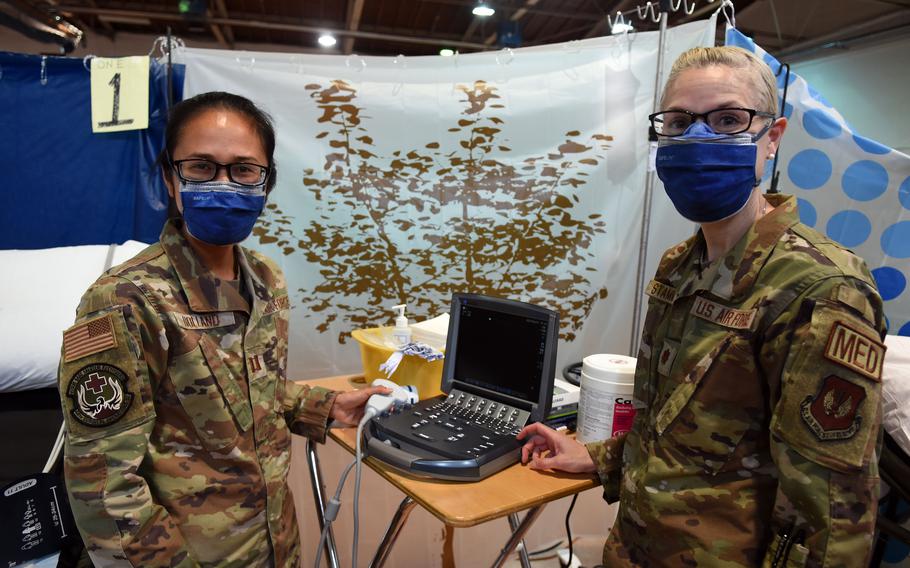 Capt. Danielle Holland and Maj. Suzanne Stammler, Air Force OB-GYN physicians with the 48th Medical Group at RAF Lakenheath, England, are part of a large medical team deployed to Germany to provide for the health care needs of evacuees temporarily staying at Ramstein Air Base and Rhine Ordnance Barracks.