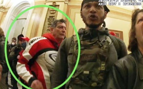 This image from the Department of Justice statement of facts to support an arrest warrant for David Walls-Kaufman, shows an image from police body-worn video, contained and annotated by the source, of David Walls-Kaufman in the U.S. Capitol Jan. 6, 2021, in Washington. (Department of Justice via AP)