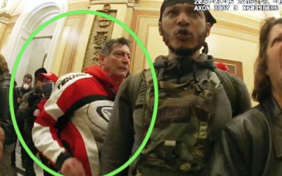 A circle around a man behind a police officer.