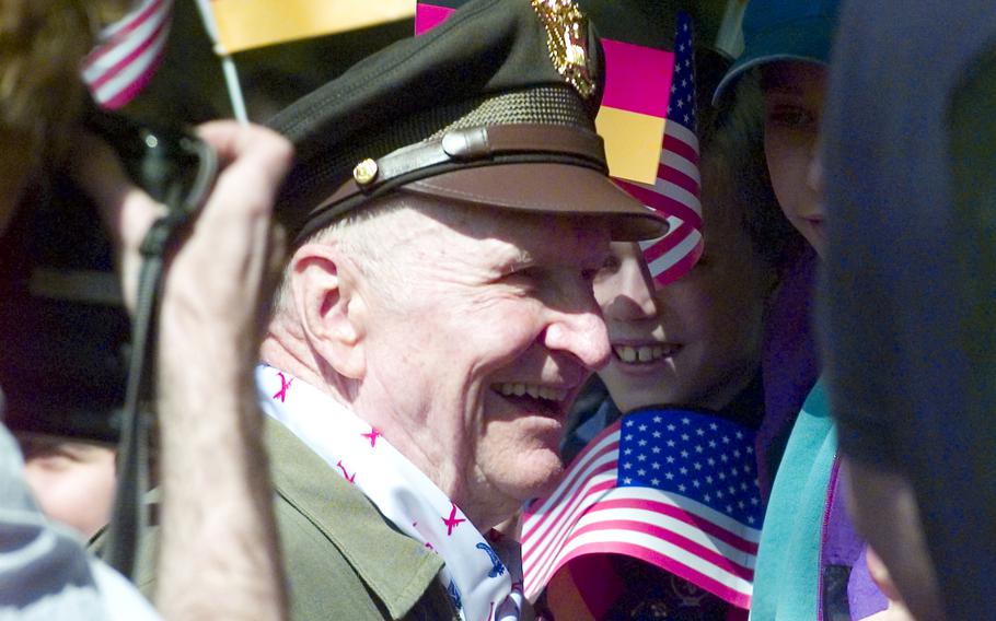 Gail Halverson, the legendary "Candy Bomber" of the Berlin Airlift, wades into the crowd at the 50th anniversary ceremony at Berlin's Templehof airport in 1998.