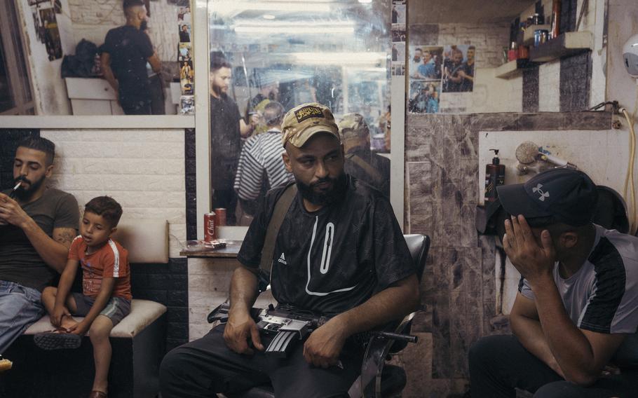 Zoufi, the commander of al-Aqsa Martyrs Brigade in the Balata refugee camp, sits in a local barbershop in the West Bank city of Nablus.