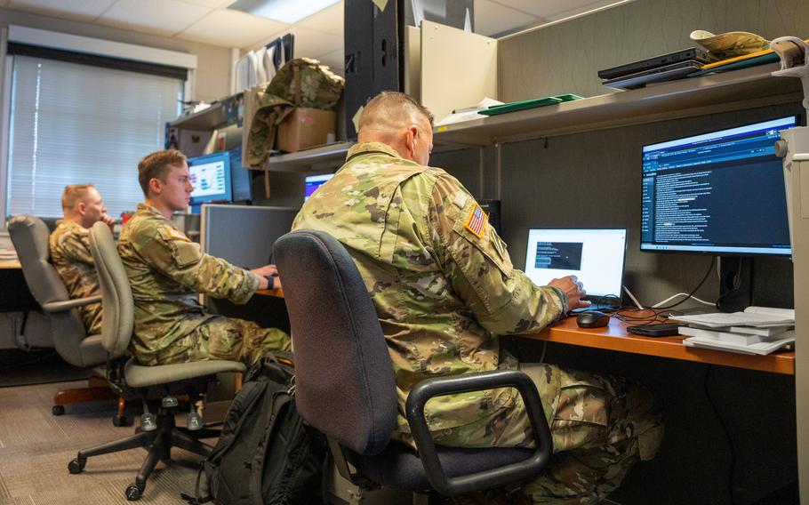 Members of Cyber Protection Team 169, Maryland Army National Guard, hunt for malicious activity on their network at the Laurel Readiness Center in Laurel, Md., during exercise Cyber Flag 22, July 25, 2022. U.S. Army Cyber Command officials said they are working to revise regulations to clearly define a 36-month service obligation to retain personnel in high-demand cyber career fields. 