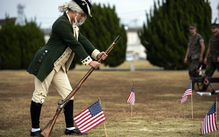 Lance Cpl. Alexis Tellshow participates in a uniform pageant to commemorate the Marine Corps’ 246th birthday at Marine Corps Air Station Iwakuni, Japan, Tuesday, Nov. 2, 2021.