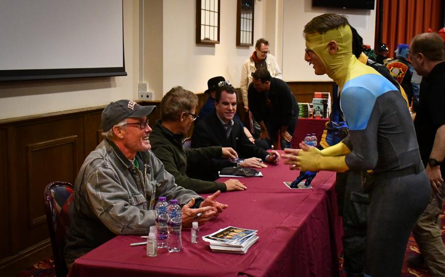 Actor John C. McGinley, best-known for his role as Dr. Cox on the show “Scrubs,” exchanges pleasantries with a fan during the Mil-D-Con celebrity meet-and-greet Oct. 1, 2022, at RAF Mildenhall.