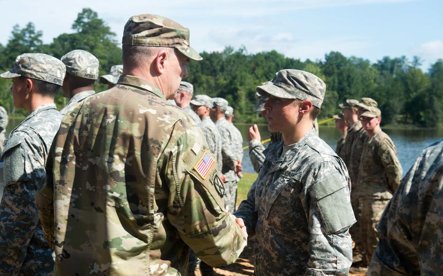 Gen. Mark Milley, the Army chief of staff, congratulates then-1st Lt. Shaye Haver and the Army Ranger School Class in August 2015 during their graduation at Fort Benning, Ga., now Fort Moore. Haver and class member then-Capt. Kristen Griest became the first female graduates of the school. 