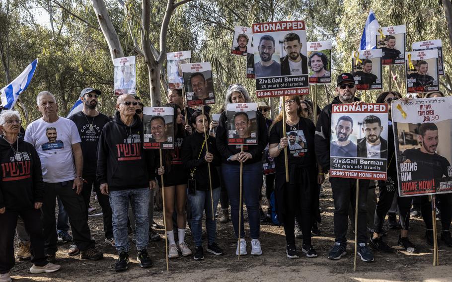 Family members of hostages held by Hamas and their supporters gather at the site of the Nova music festival in southern Israel in February to demand the release of their loved ones. 