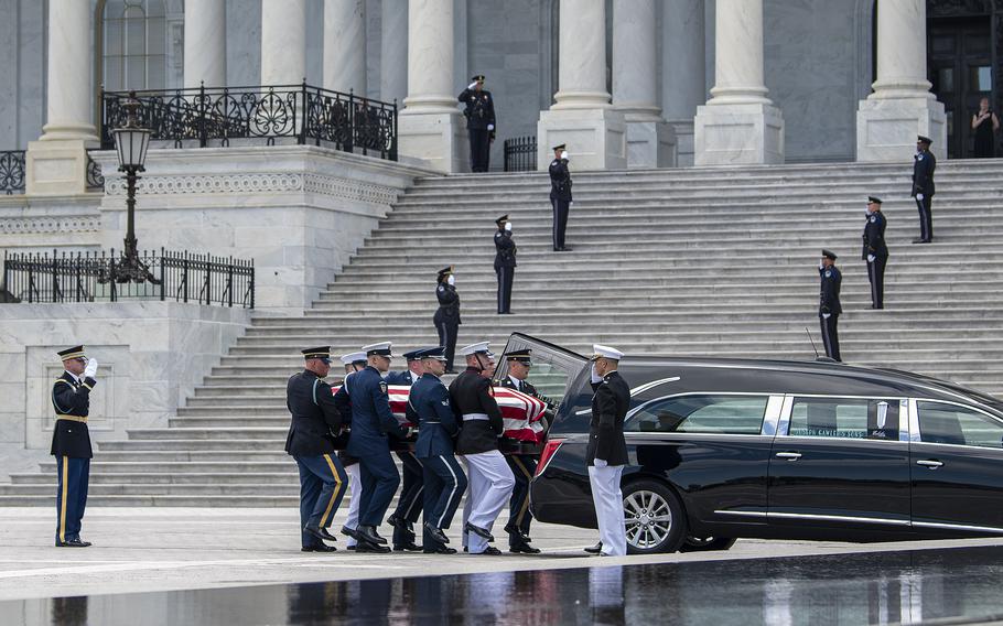 Members of a U.S. military honor guard march to a hearse as they carry the casket of WWII veteran Hershel Woodrow "Woody" Williams after exiting the U.S. Capitol, where Williams was lying in honor for several hours on Thursday, July 14, 2022. Williams, who was the last living Medal of Honor recipient who fought in World War II, died on June 29. He was 98.
