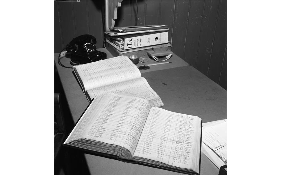 Record books lie open on the desk of one of the investigators of the International Tracing Service’s offices in Esslingen, in Baden-Wuerttemberg.