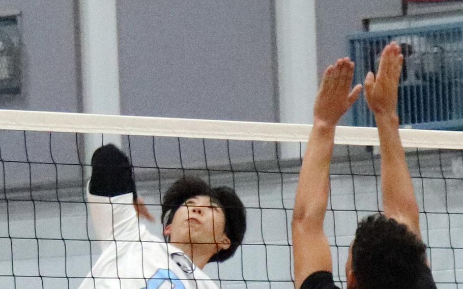 Timothy Petrae, left, is one of eight players returning to Osan's boys volleyball team.