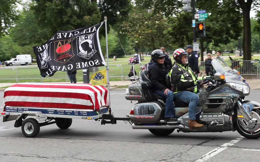 Motorcyclists taking part in the Rolling to Remember ride through Washington, D.C. pass the U.S. Capitol on May 30, 2021.