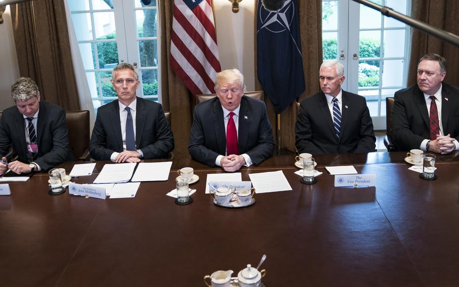 Donald Trump, center, speaks with NATO Secretary General Jens Stoltenberg, left, during a meeting at the White House in May 2018.
