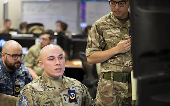 U.S. Space Force 1st Lt. Joseph Curiel, 10th Space Warning Squadron, middle, leverages his ground-based radar expertise to weaponeer coalition forces during training at Schriever Space Force Base, Colo., Dec. 13, 2022. 