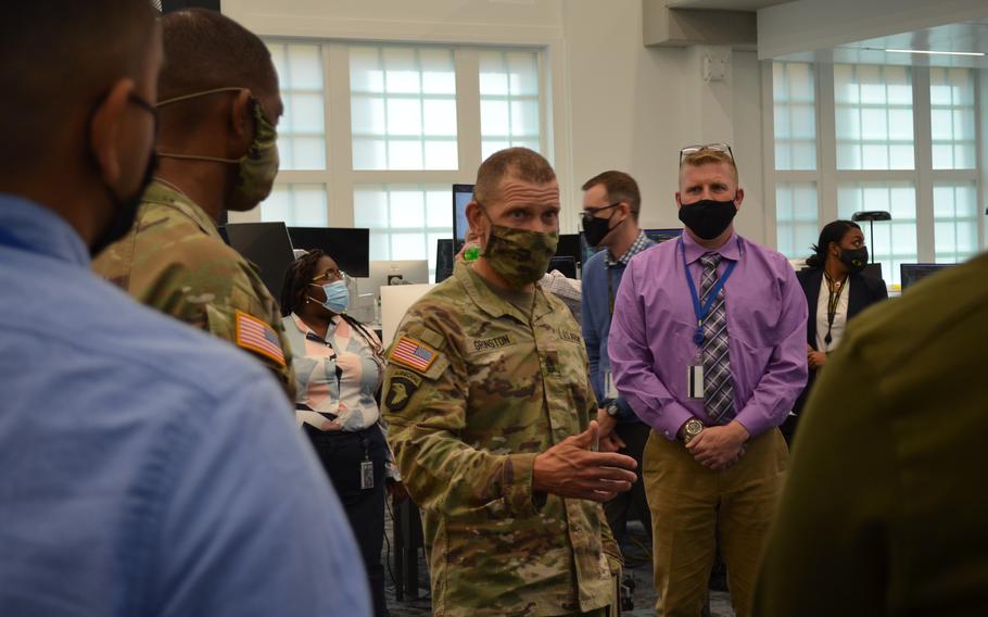 Sgt. Maj. of the Army Michael Grinston discusses the This is My Squad app with the team of soldiers developing it at the Army Software Factory in Austin, Texas., on Oct. 28, 2021. The app is named for Grinston’s signature program and aims to improve time management for troops.