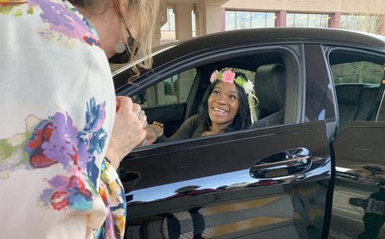 A pregnant military veteran receives a tiara at a drive-thru baby shower run by the Atlanta VA Clinic. "We are very well aware of the maternal mortality statistics, which are terrible in the Southeast and impact Georgia in very high numbers," says Kathleen O'Loughlin, manager of the Atlanta VA’s women veterans program.