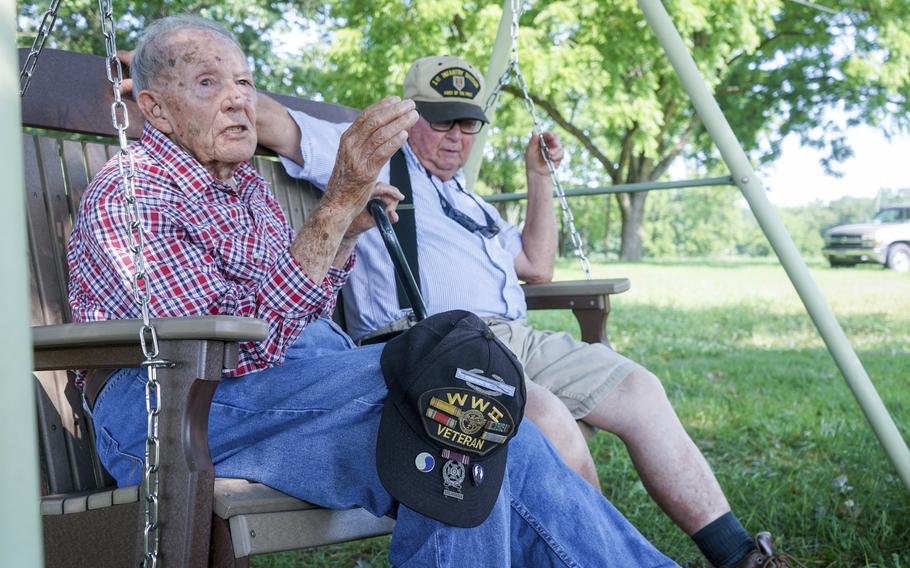 World War II veteran Beverly Salyards, left, sits with Vietnam veteran Larry Ritchie, right, at Ritchie's home in Rockingham County, Va. 