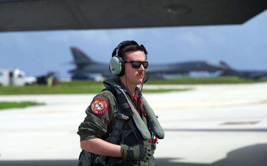 Air Force Maj. Abraham Moreland, a 34th Expeditionary Bomb Squadron pilot, waits to board a B-1B Lancer for a Cope North mission at Andersen Air Force Base, Guam, Feb. 10, 2023.