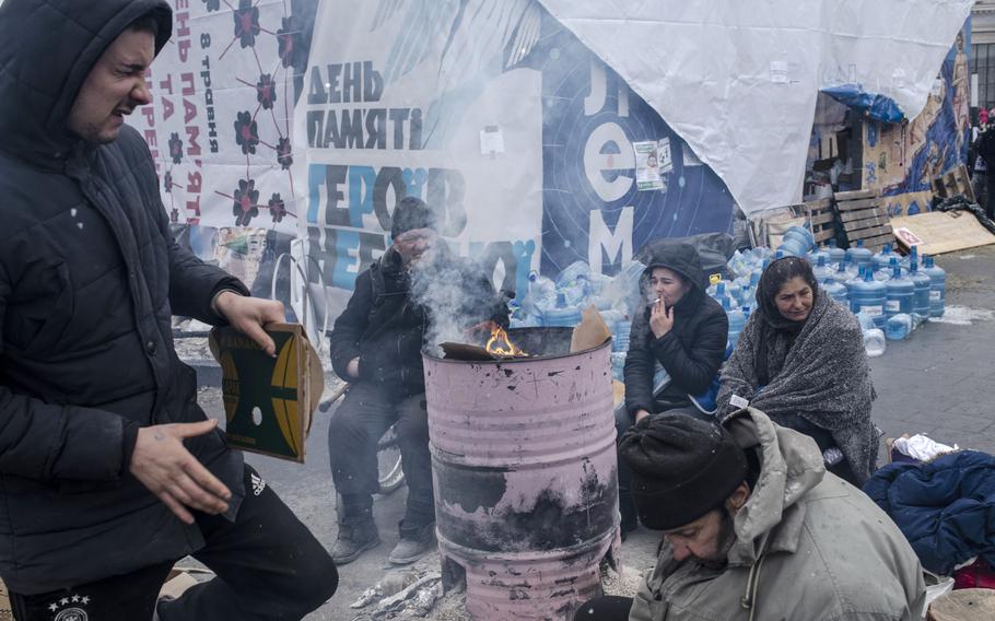 People hoping to flee to Poland wait hours to enter the main railway station in Lviv on March 7. 