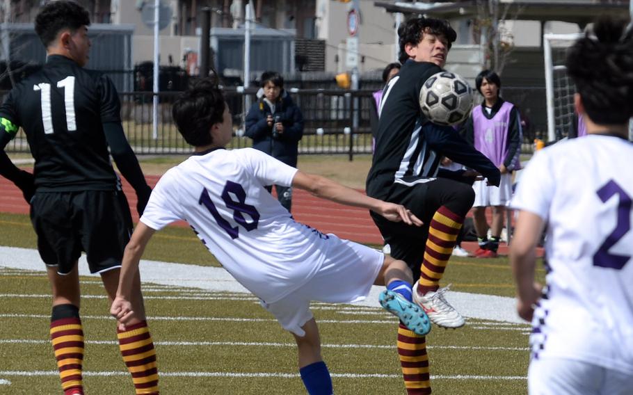 Perry’s Cooper Allen goes up to play the ball against Senri Osaka during Saturday’s Perry Cup semifinal, won by the Samurai in penalties.