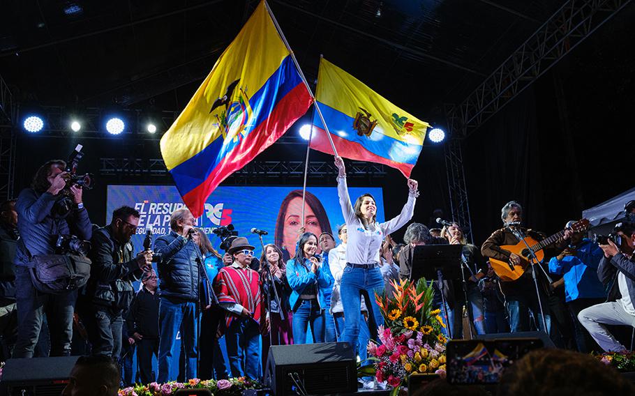 Candidate Luisa González waves Ecuador’s flag at her closing rally. 