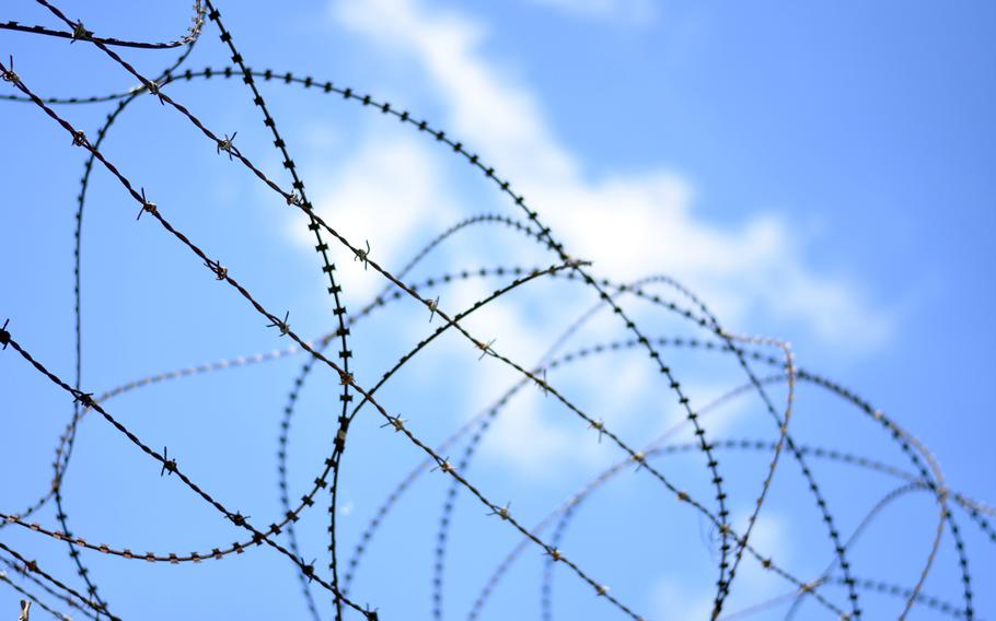 Barbed and conertina wire top fencing close to the Imjin River near the Demilitarized Zone between North and South Korea in this photo from May 2017.