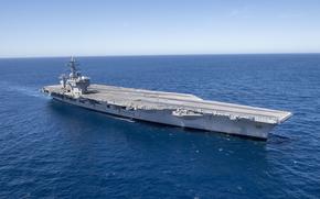 The aircraft carrier USS Nimitz cruises the Pacific Ocean, on March 12, 2022. Nimitz is once again underway after resolution of a problem with the potable water system suspected of sickening at least 11 sailors was. The ship left San Diego on Oct. 2.