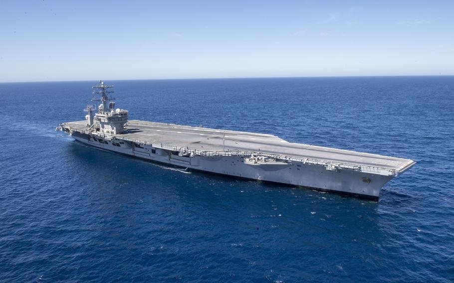 The aircraft carrier USS Nimitz cruises the Pacific Ocean, on March 12, 2022. Nimitz is once again underway after resolution of a problem with the potable water system suspected of sickening at least 11 sailors. The ship left San Diego on Oct. 2.