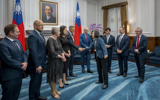 In this photo released by the Taiwan Presidential Office, visiting Australian lawmakers is greeted by Taiwan's President Tsai Ing-wen at the Presidential Office in Taipei, Taiwan, Tuesday, Sept. 26, 2023.
