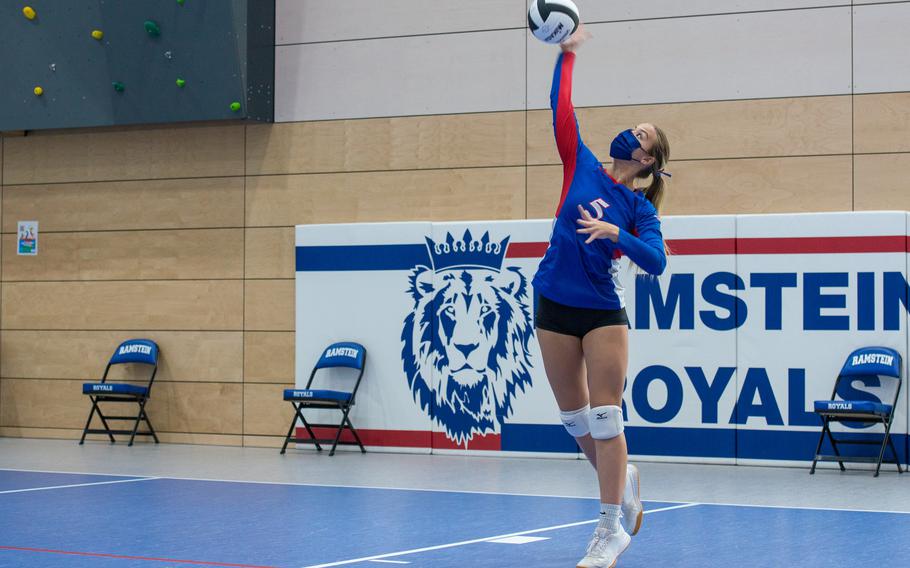 Spice Harris of the Ramstein Royals serves the ball in a game against the SHAPE Spartans during the DODEA-Europe Division I Volleyball Tournament  at Ramstein Air Base, Germany, Oct. 29, 2021. Harris is a senior from Loganville, Ga.