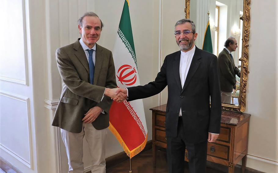 In this photo released by the Iranian Foreign Ministry, Enrique Mora, a leading European Union diplomat, left, shakes hands with Iran’s top nuclear negotiator Ali Bagheri Kani in Tehran, Iran, March 27, 2022. Mora, the European Union coordinator of talks to revive Iran’s nuclear accord with world powers said Tuesday, May 10, 2022, that he was traveling to Tehran, as the bloc makes a last-ditch effort to salvage the deal after a weeks-long standstill. 