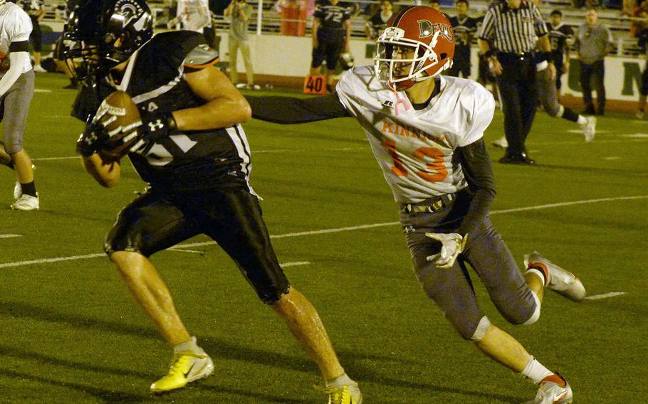 Zama tight end Caleb Schmiedel turns up field away from Nile C. Kinnick defender Justice Rose.