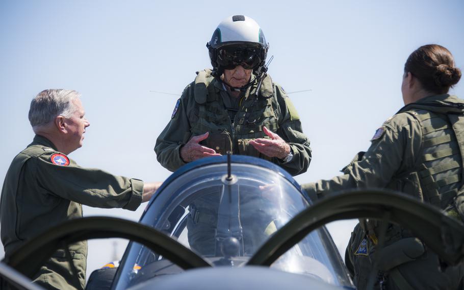 Retired Cmdr. Dean “Diz” Laird, center, stands in the rear seat of a T-34C Turbomentor with the “Flying Eagles” of Strike Fighter Squadron (VFA) 122, in Coronado, Calif., July 9, 2016. The T-34C marked the 100th aircraft Laird had flown.