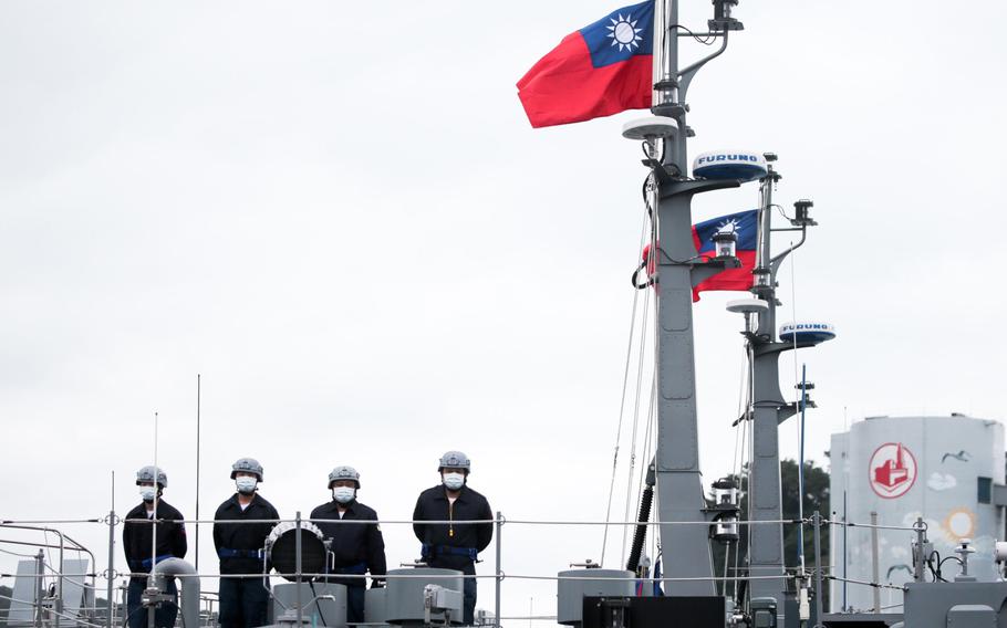 Soldiers stand onboard a Taiwan Navy minelayer on Jan. 7, 2022. 