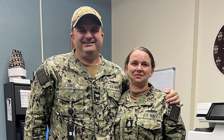 Senior Chief Petty Officer Jessica Saunders poses with Capt. Justin Long, commanding officer of Surface Combat Systems Training Command San Diego. Saunders is the first senior chief gunners mate to be promoted to master chief petty officer in Navy history. 