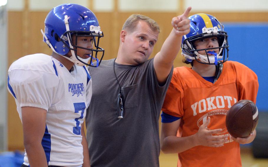 Assistant coach Joshua Long talks offense.