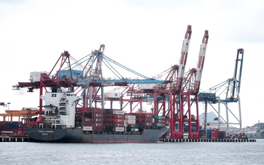 Gantry cranes and a container ship at the Port of Keelung in Keelung, Taiwan, on Jan. 7, 2022. 