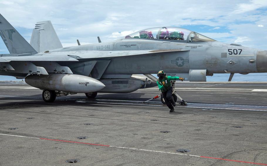 An EA-18G Growler prepares to launch from the flight deck of the aircraft carrier USS Ronald Reagan in the Philippine Sea, July 9, 2022. The Navy announced July 26 it was replacing a defective component in ejector seats used on some of its aircraft, including the Growler. 