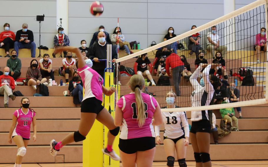 Vilseck’s Meaalofa Crawford, center, prepares to slam the ball during a volleyball match against Hohenfels at Vilseck, Germany, Saturday, Oct. 9, 2021.