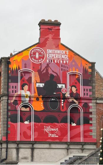 Mural on the side of a building advertising the the Smitchwick’s Experience