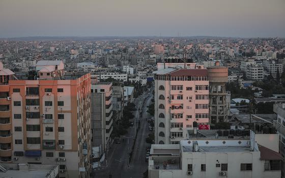 A photo from the top of Al-Wehda Street in Gaza City, considered the area's busiest street for traffic, is nearly empty on Aug. 25 because of the lockdown. MUST CREDIT: photo for The Washington Post by Loay Ayyoub.