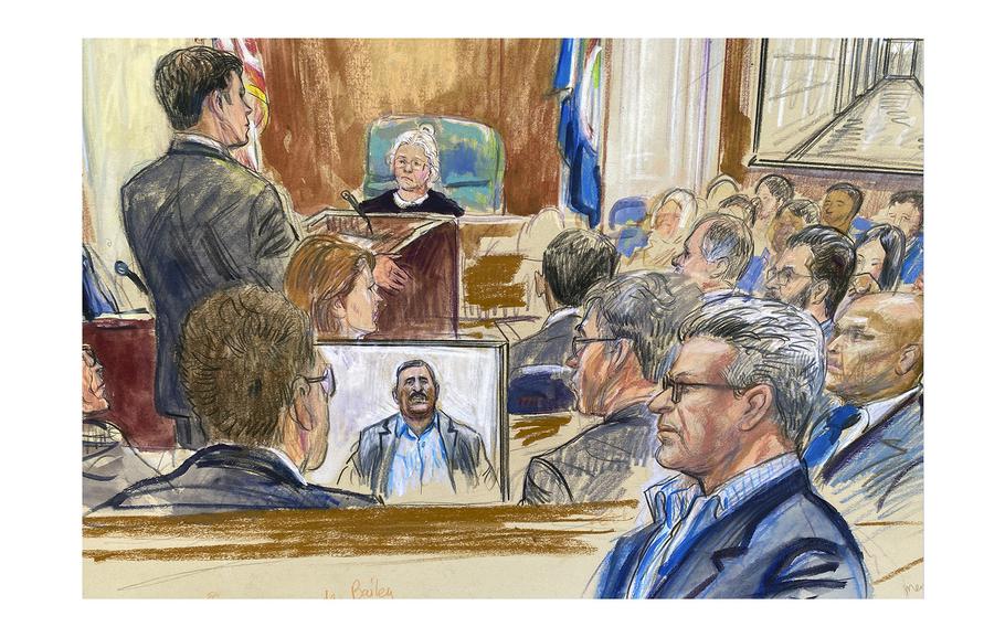A courtroom artist’s sketch depicts Salah Al-Ejaili, foreground right with glasses, a former Al-Jazeera journalist, before the U.S. District Court in Alexandria, Va., Tuesday, April 16, 2024.  Al-Ejaili, a former detainee at the infamous Abu Ghraib prison, has described to jurors the type of abuse that is reminiscent of the scandal that erupted there 20 years ago: beatings, being stripped naked and threatened with dogs, stress positions meant to induce exhaustion and pain.